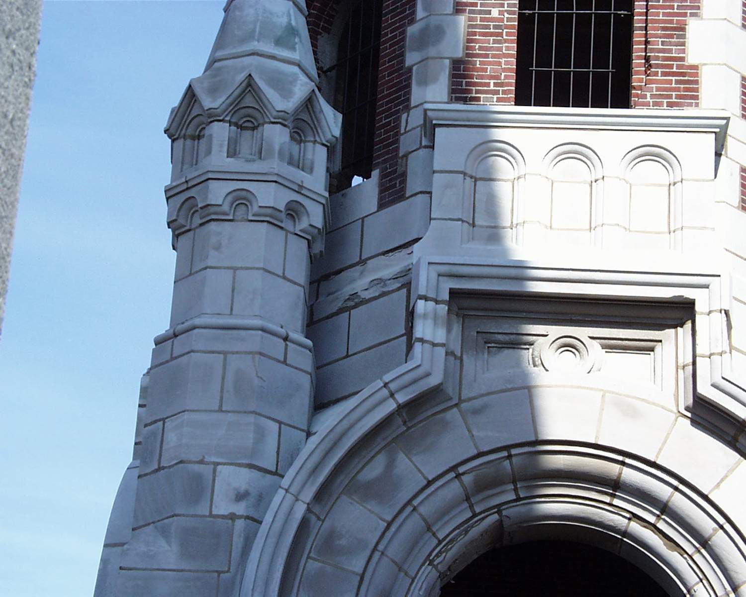 Holy Hill masonry restoration - West tower stone damage above bells